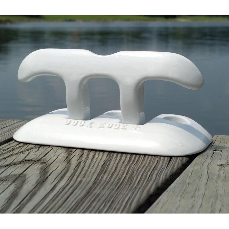 White flip up dock cleat raised on a weathered dock board