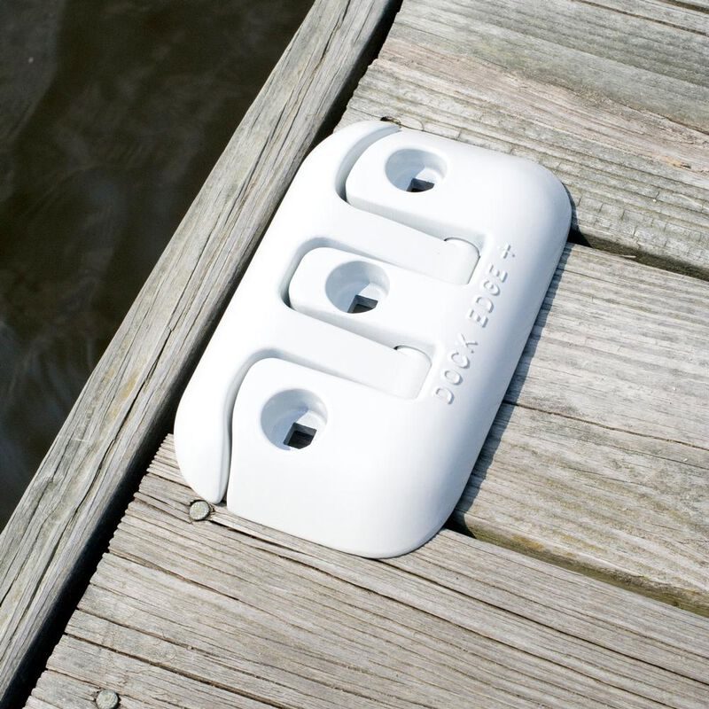 Flip up dock cleat folded flat against gray dock decking