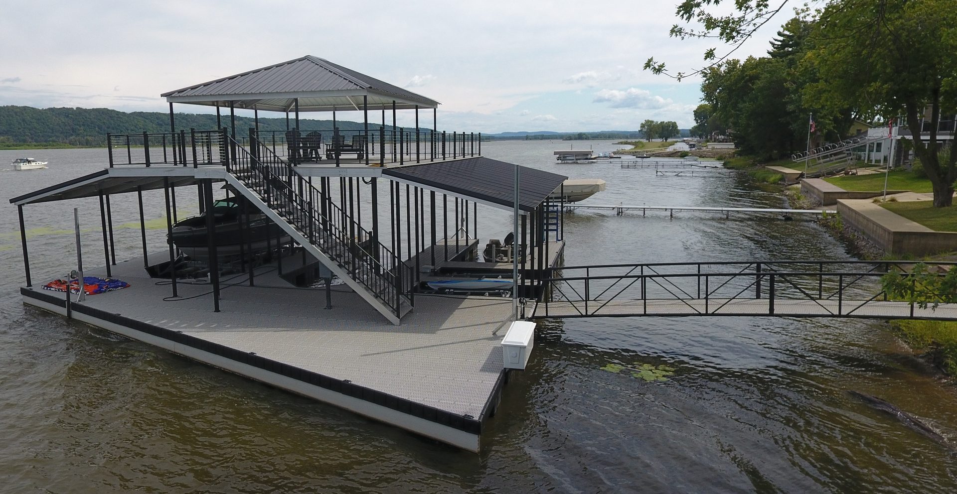 Custom two-story dock with covered slips, Guttenberg area