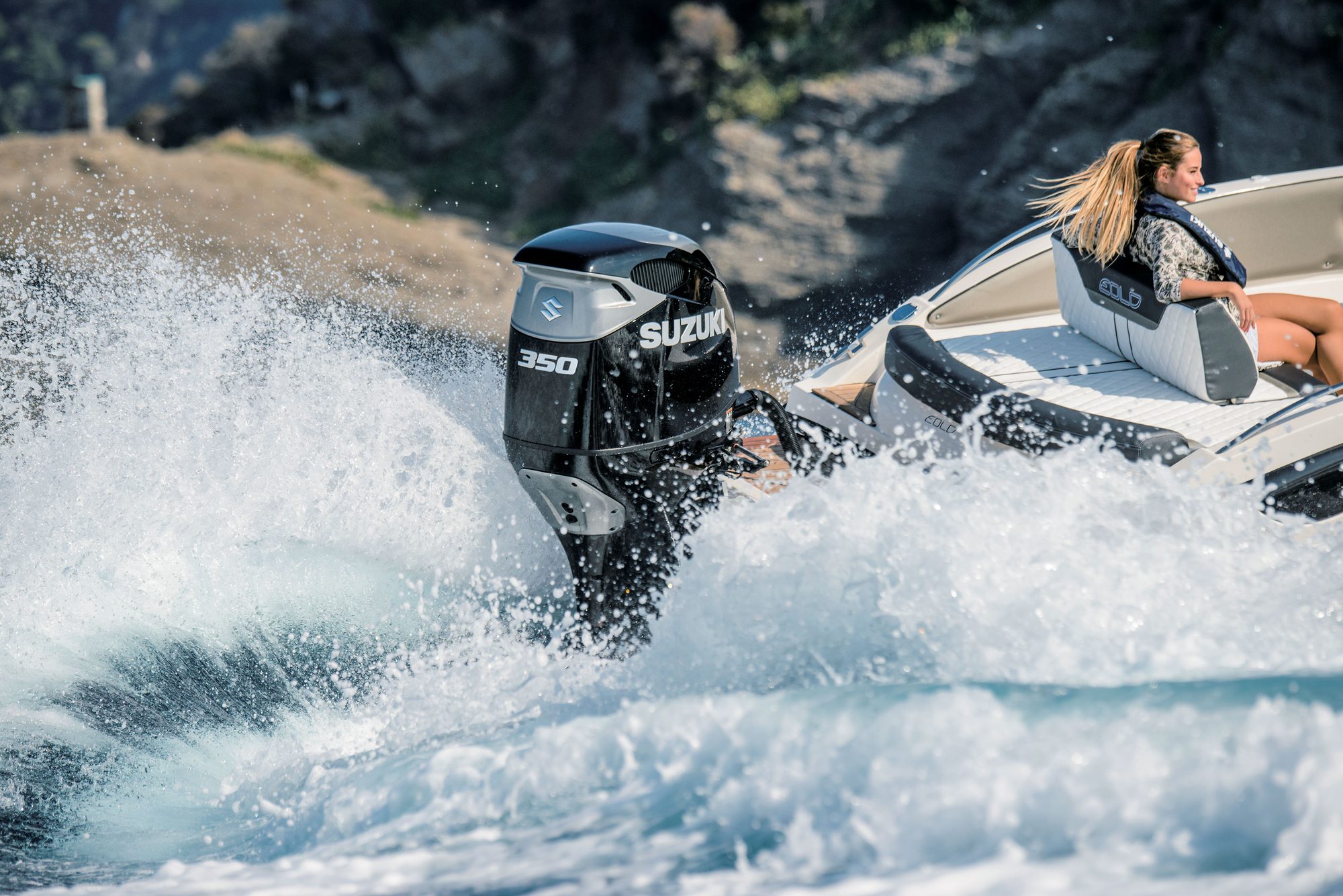 Suzuki DF350A powering a boat through the spray