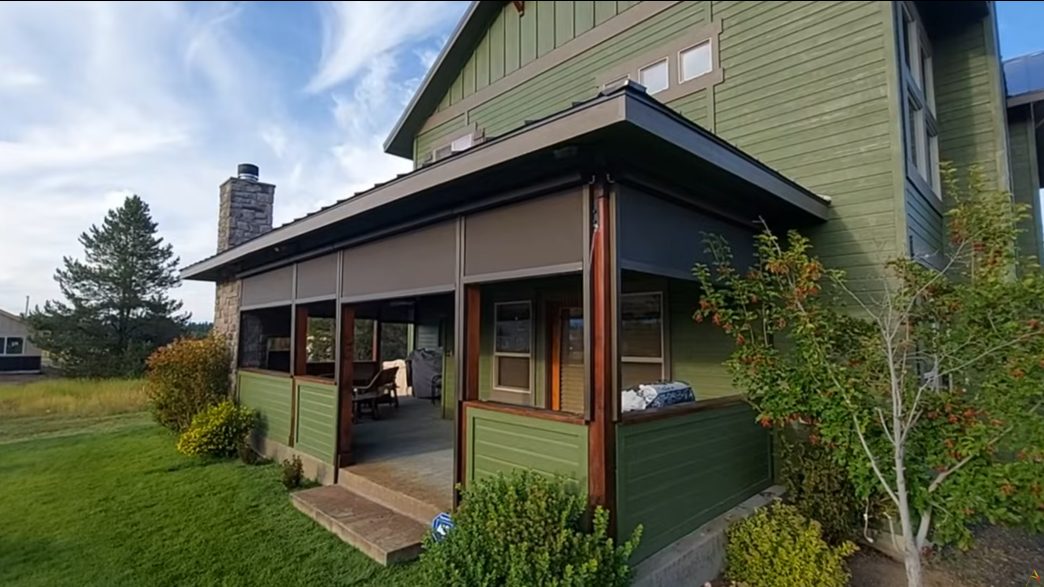 Rustic timber cabin porch with Apollo screens