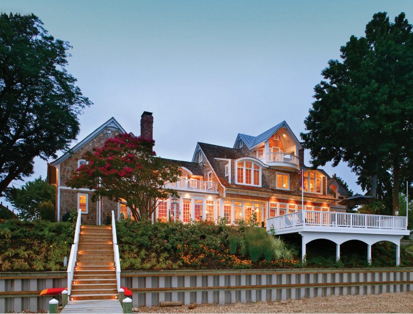 Lakefront home with vinyl seawall at dusk