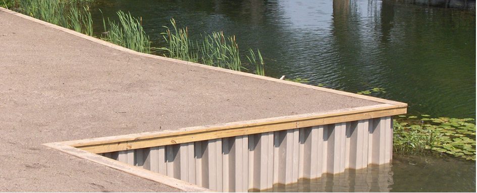 Angled river wall panel installation